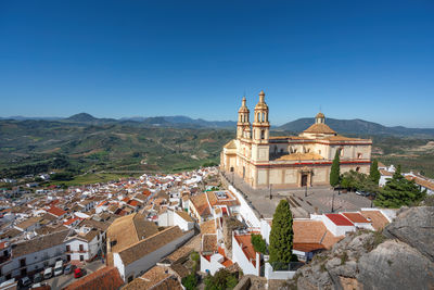 High angle view of townscape against clear blue sky