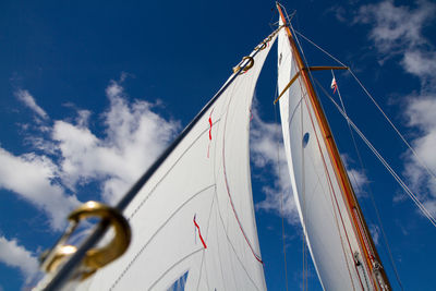 Low angle view of mast against sky on sunny day