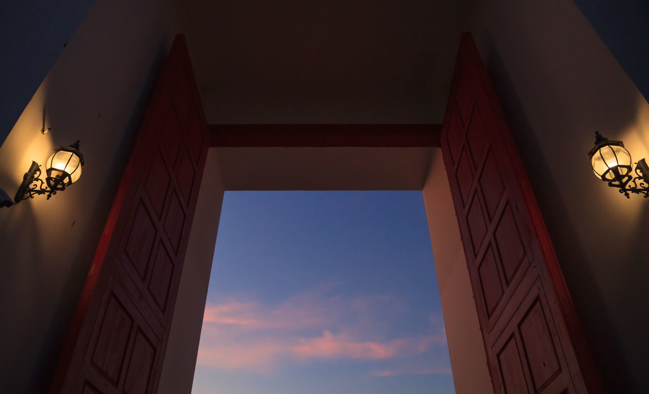 LOW ANGLE VIEW OF ILLUMINATED BUILDINGS AGAINST SKY