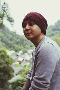 Side view portrait of man against mountains