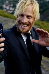 Portrait of young man using mobile phone