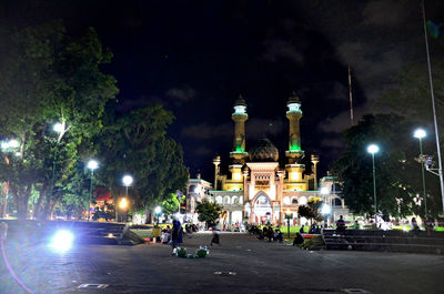 Illuminated buildings in city at night