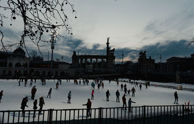 Group of people in front of building during winter