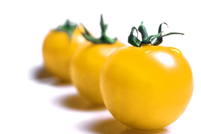 Close-up of lemon against white background