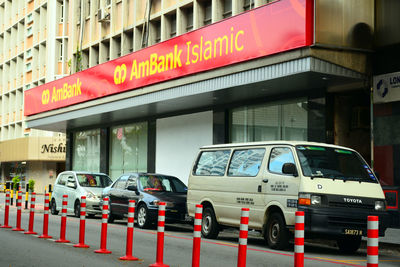 View of traffic sign on road in city