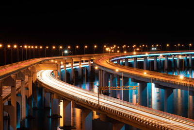 High angle view of illuminated bridge at night