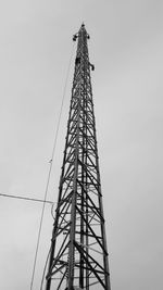 Low angle view of communications tower against sky