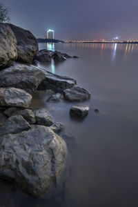 Scenic view of sea against sky at night