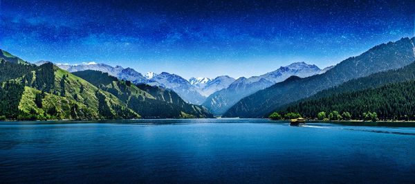 View of lake with mountain range in background