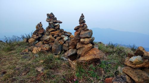 Stack of rocks against sky