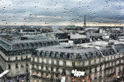 Cityscape seen through wet window