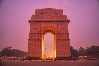 India gate view of monument at sunset