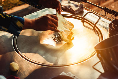 Cropped image of hand making roti