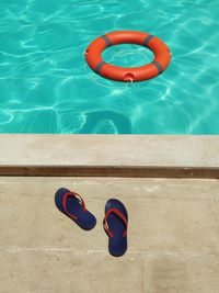 High angle view of ring floating on swimming pool