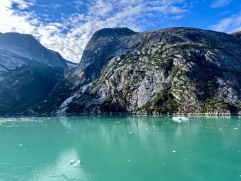 Scenic view of lake and mountains against sky - endicott arm fjord