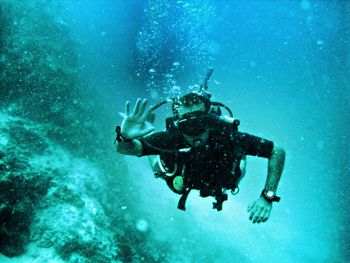 Man waving underwater