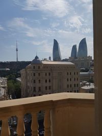 Buildings in city against sky