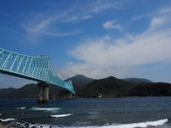 View of bridge over sea against sky