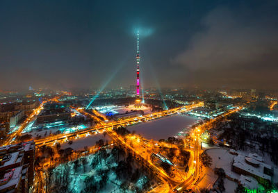 Aerial view of illuminated buildings in city at night