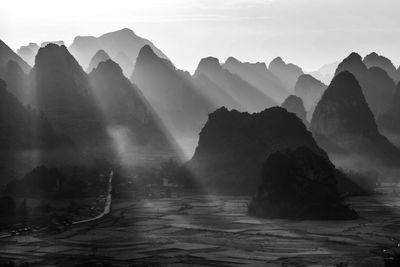 Scenic view of rocks in mountains against sky