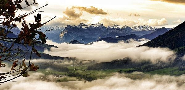 Scenic view of snowcapped mountains against sky