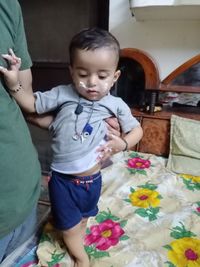 High angle view of cute boy standing outdoors