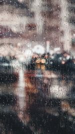 Full frame shot of wet glass window during rainy season