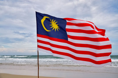 Close-up of flag against sky