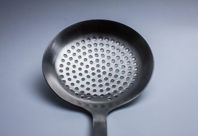 Close-up of cooking utensil over white background