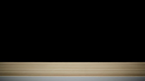 Empty basketball hoop against black background