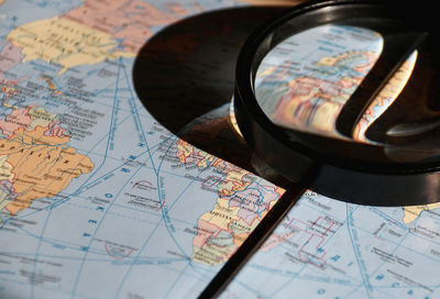 Close-up of magnifying glass on map