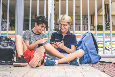 Friends sitting on mobile phone