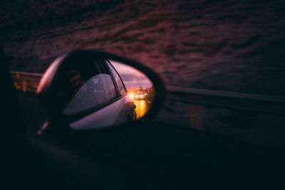 Reflection of road on side-view mirror