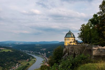 Panoramic view of historic building and mountains against sky