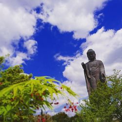 Low angle view of statue against sky