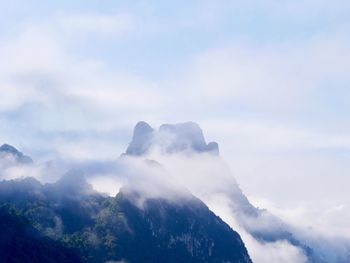 Low angle view of volcanic mountain against sky