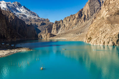 Panoramic view of sea and mountains against blue sky