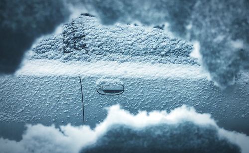Close-up of raindrops on snow