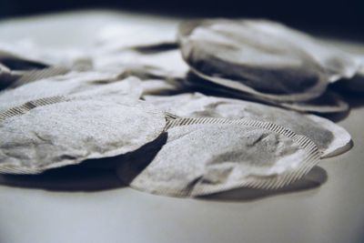 Close-up of teabags on table