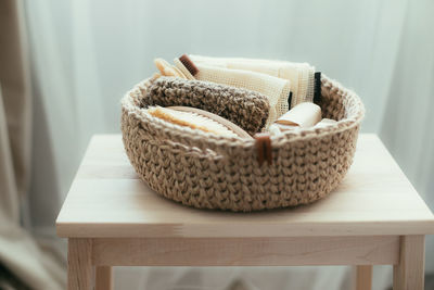 Close-up of wicker basket on table at home