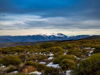 Scenic view of snowcapped mountains against sky