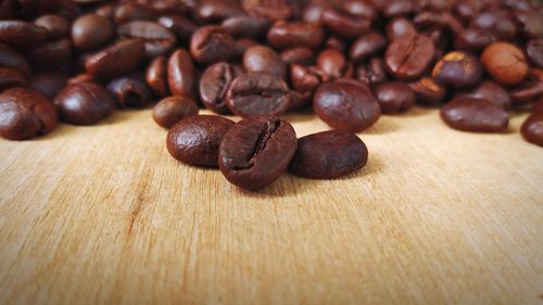 Close-up of coffee beans on table