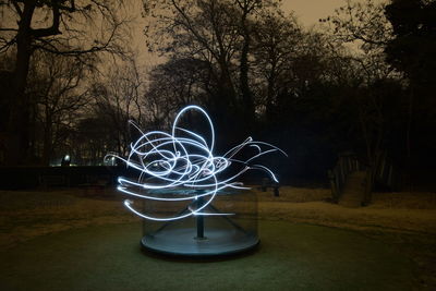 Light painting on table in park at night