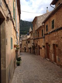 Narrow alley with buildings in background