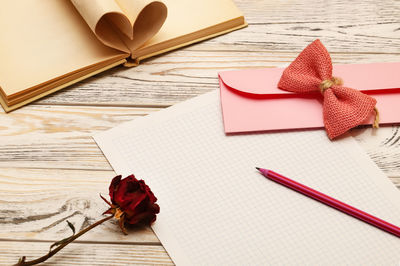 High angle view of red flower on table