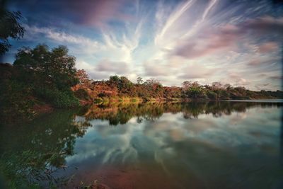 Scenic view of lake against sky during sunset