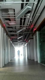 Man walking in corridor