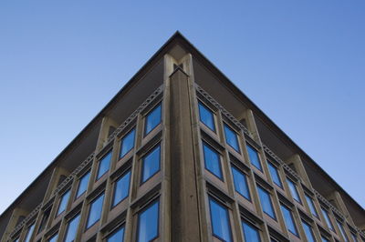 Low angle view of building against clear blue sky