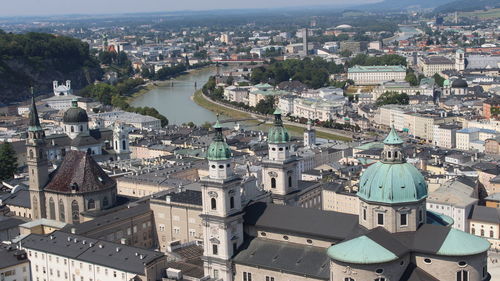 High angle view of illuminated buildings in city