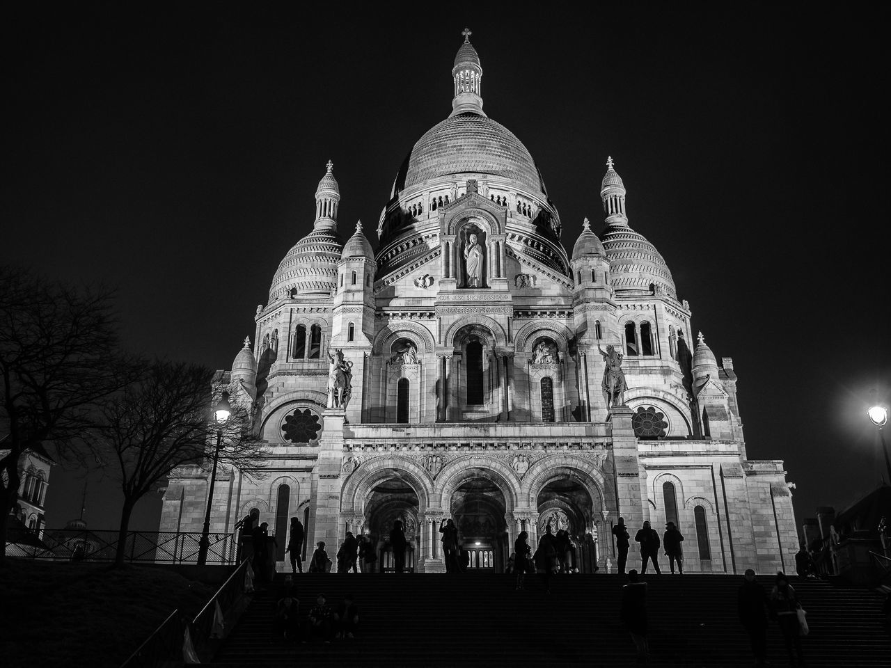 LOW ANGLE VIEW OF ILLUMINATED BUILDING AGAINST SKY